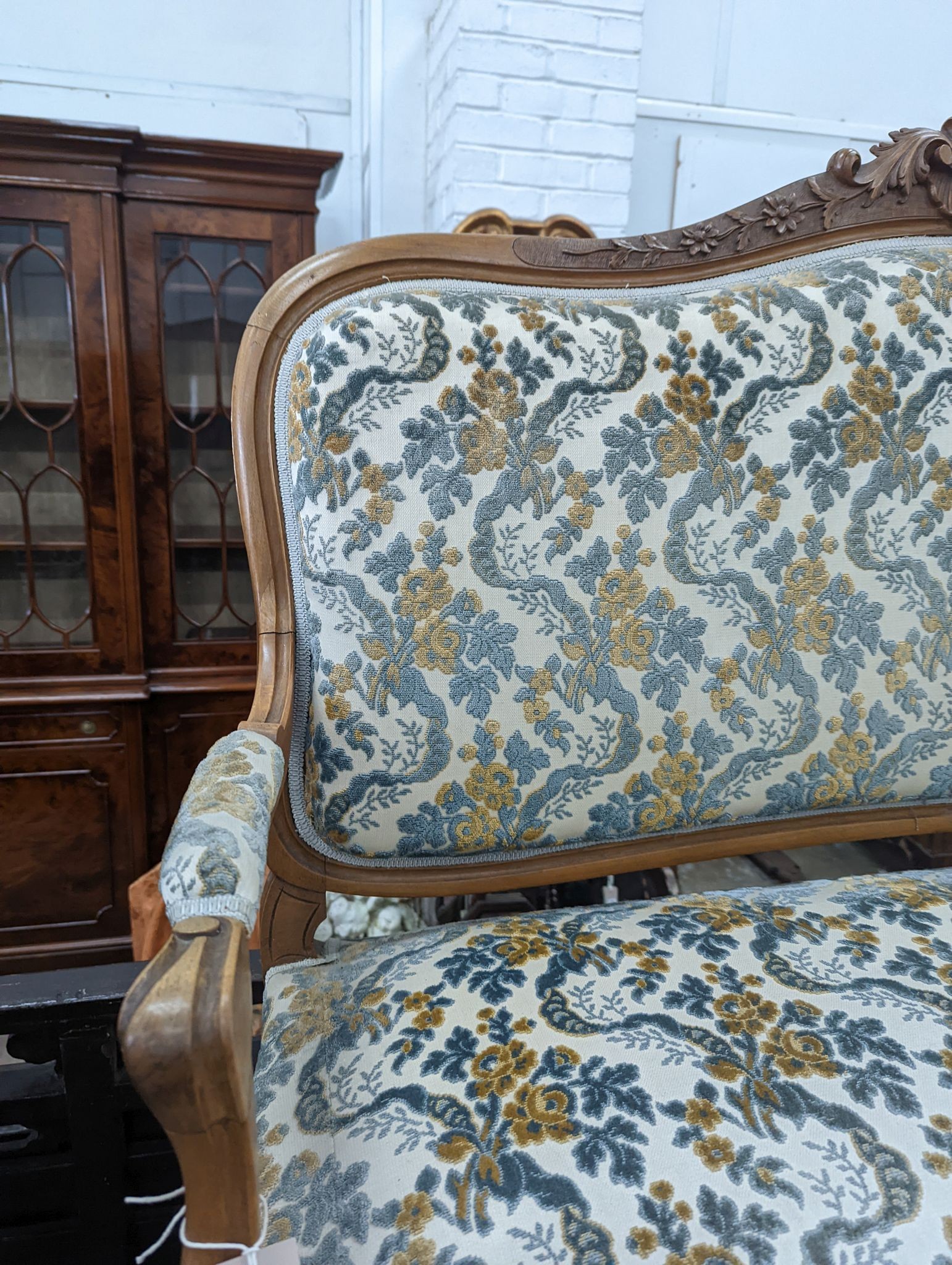 A Louis XVI style carved walnut settee (wormed), length 140cm, depth 58cm, height 104cm